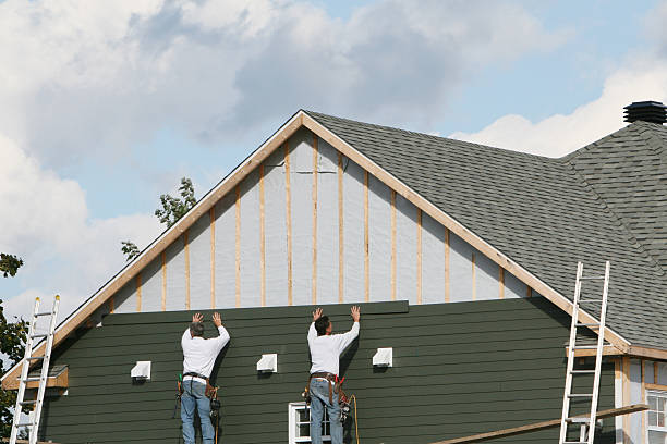 Professional Storm Damage Siding Repair technician working in Leavittsburg, OH